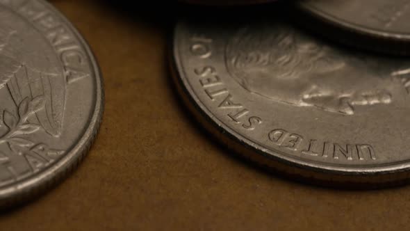 Rotating stock footage shot of American quarters (coin - $0.25) - MONEY 0218
