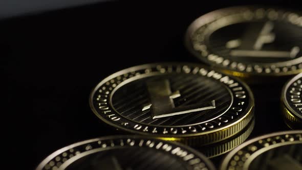 Rotating shot of Bitcoins (digital cryptocurrency) - BITCOIN LITECOIN