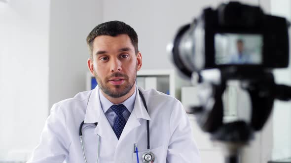 Doctor with Camera Recording Video Blog at Clinic