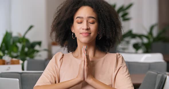 Portrait of Cute Calm Curly Girl Afro American Woman Folds Her Hands in Front of Her Touches Palms