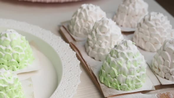 Marshmallow Cones, Sprinkled With Powdered Sugar. Are Laid Out On Trays. Close Up Shot.