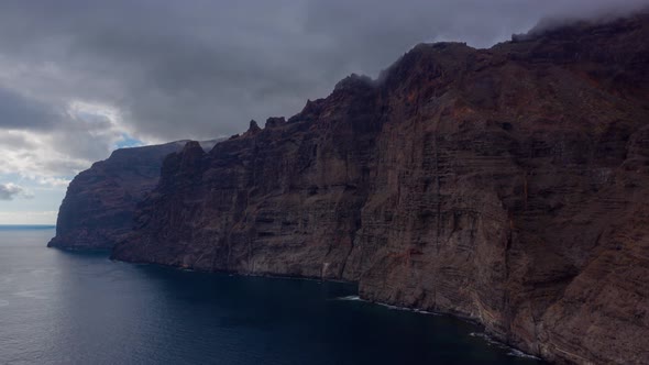 Aerial Hyperlapse of Los Gigantes Cliffs on Tenerife Overcast Canary Islands Spain