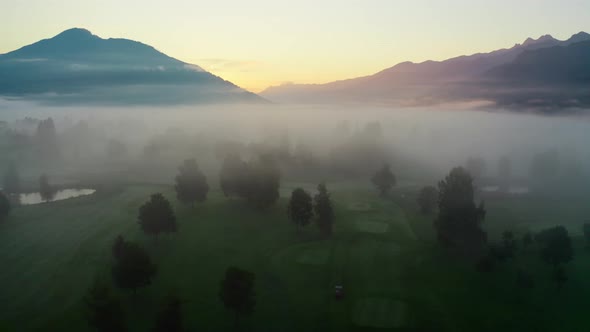 Drone Over Ethereal Misty Landscape Of Zell Am See At Sunrise