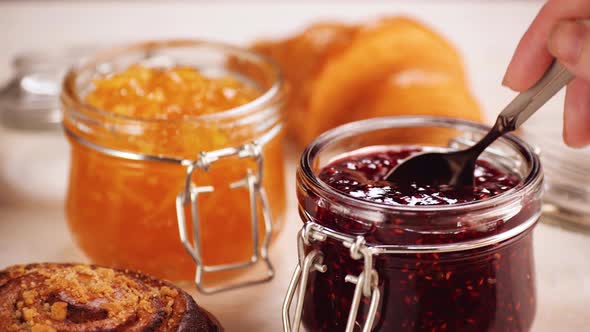 Anonymous Person Taking Sweet Jam From Jar