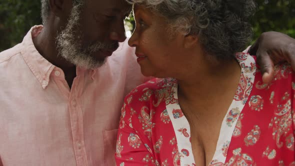 A senior african american couple spending time together in the garden in love social distancing in q