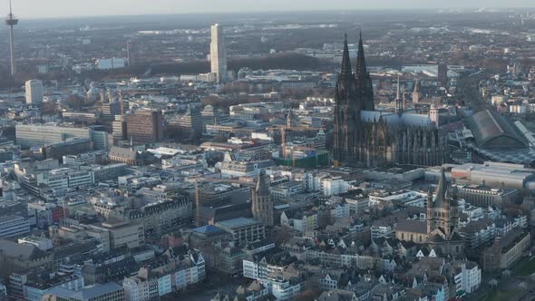 AERIAL: Wide Shot of Cologne Germany From the Air with Majestic Cathedral on Sunny Day 