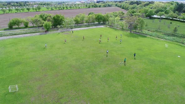 Aerial View of Young Soccer Forward Scoring Goal