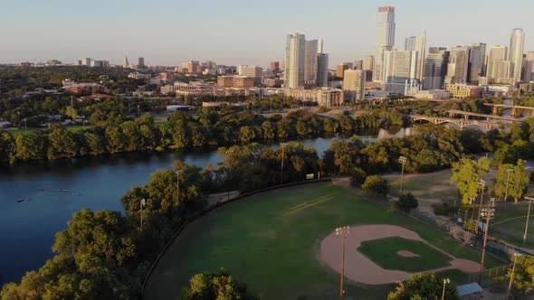 Aerial Drone shot of a Horizontal pan from a baseball field to downtown Austin, Tx.