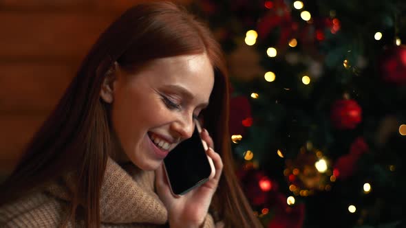 Close-up Face of Cheerful Red-haired Woman with Emotion of Joy and Happy During Talking on Phone