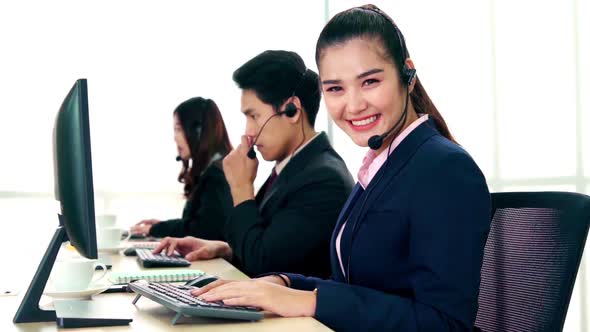 Business People Wearing Headset Working in Office