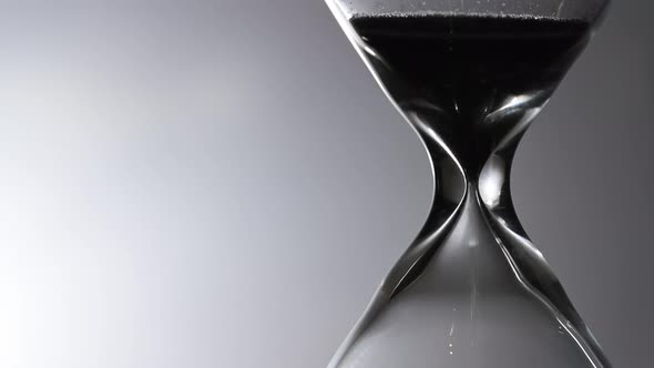 Close Up Of Hourglass In Black And White. 