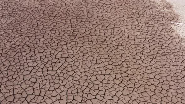 A Deserted Landscape with Cracked Ground of a Parched Lake