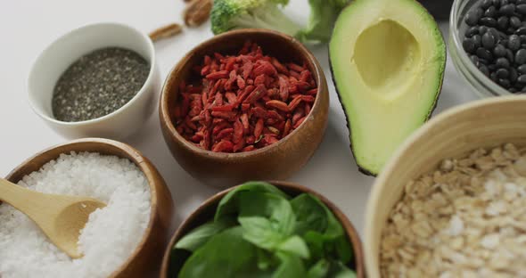 Video of close up of fresh apple and bowls of plant based ingredients