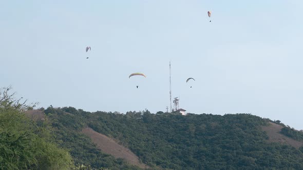 Tourists Experience Extreme Sport with Parachutes in Tropics