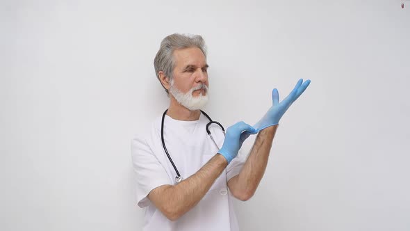 Doctor Wearing Clean Protective Gloves Before Operation