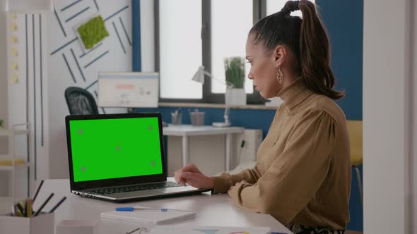 Business Woman Working with Green Screen on Laptop