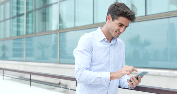 Man use of mobile phone in Hong Kong city