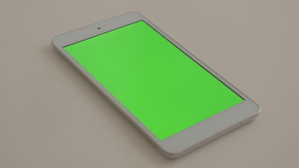 Tablet-pc greenscreen display slow  pan 4K 3840X2160 UltraHD footage - Tablet PC with green screen d