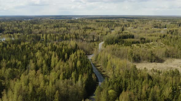 Aerial view overlooking a winding road in the Porvoo archipelago, on a sunny, spring day, in the Saa