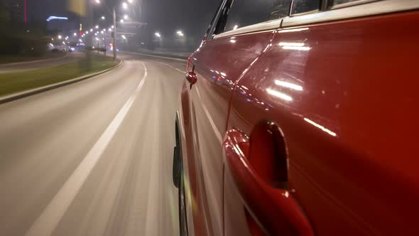 Drivelapse Urban Look From Fast Driving Car at a Night Avenue in a City Timelapse Hyperlapse