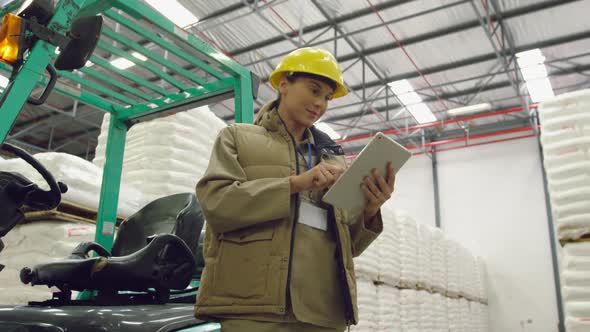 Portrait of young female worker in a warehouse