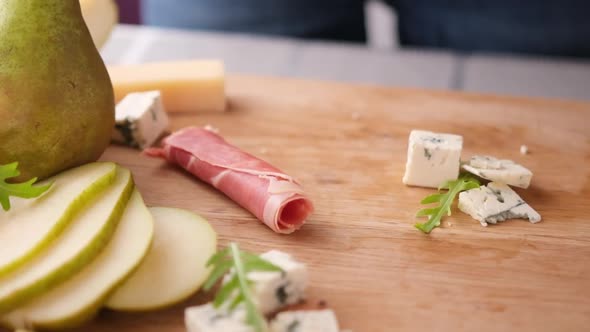 Making Pear and Blue Cheese Salad  Slices of Jamon