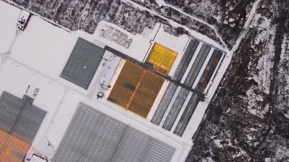 Large Greenhouse Complex on the Outskirts of the City in Winter Top View
