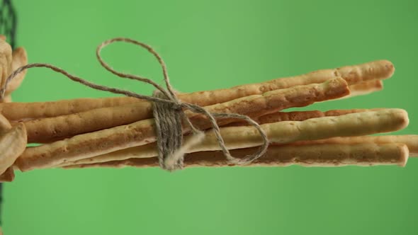 Vertical video, Close-up: Italian pastries on a lattice pattern, Italian bread sticks