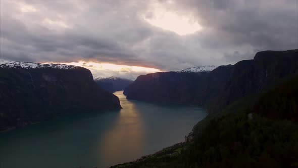 Fjord in Norway viewed from air on cloudy evening.