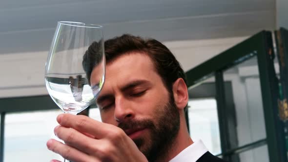 Waiter examining a empty wine glass