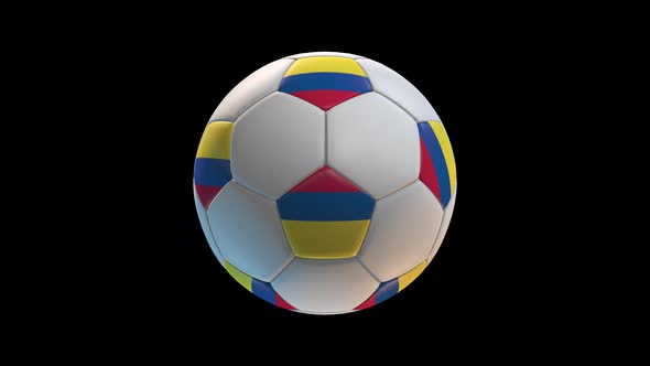 Soccer ball with flag Colombia, on black background loop alpha