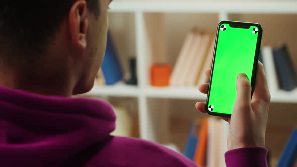 Man Using Smartphone with Chroma Key Closeup