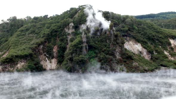 Waimangu Volcanic Rift Valley hot spring and closeup of Cathedral Rock smoking with Frying Pan Crate