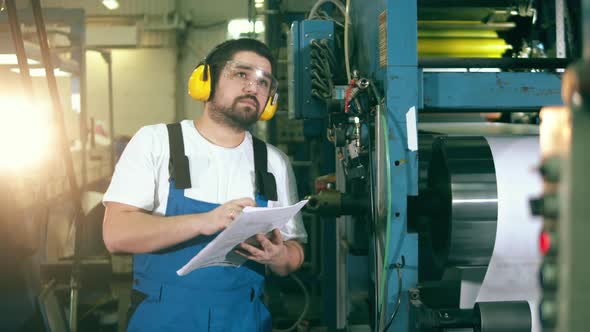 Typography Engineer Is Observing and Taking Notes