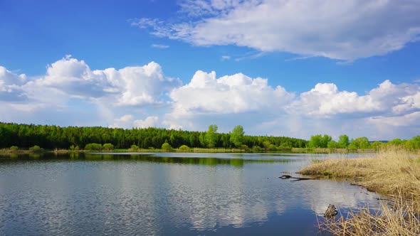 Clouds Are Reflected in Smooth Water of Lake