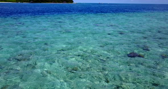 Wide angle drone tourism shot of a summer white paradise sand beach and blue sea background in best 