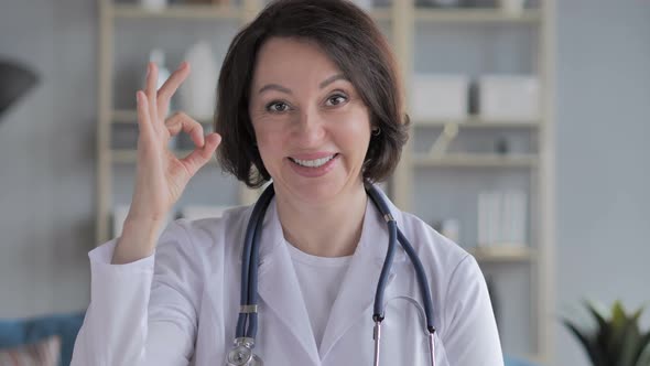 Portrait of Old Lady Doctor Gesturing  Okay Sign