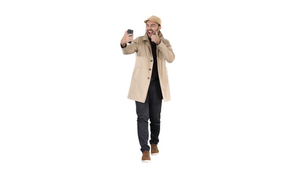 Cheerful Man in Coat Taking Photo Making Selfie on White