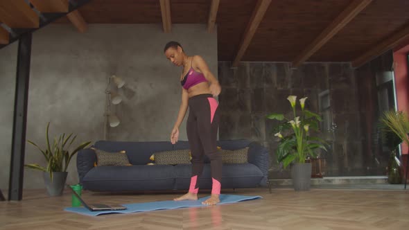 Fitness Female Doing Bent Over Twist Exercise