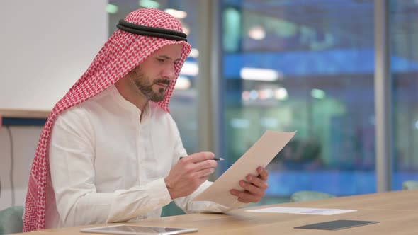 Hardworking Arab Businessman Reading Documents