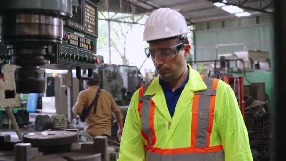 Smart Factory Worker Using Machine in Factory Workshop