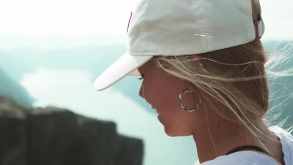 Closeup of a Hiker at the Kjeragbolten Over Looking Nature in a Morning Hike