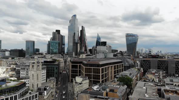 Aerial view rising up approaching the office buildings in the City of London Financial District