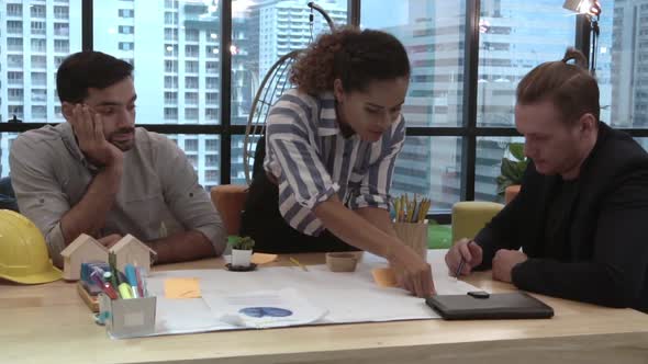 Creative Business People Group Having Conversation at Office Desk in Workplace