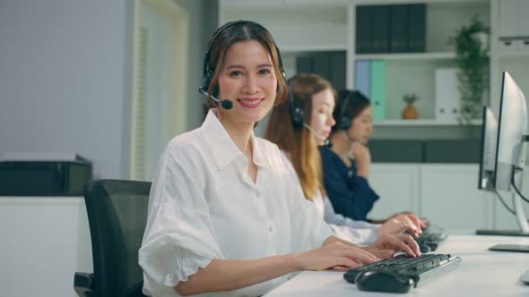 Portrait of Asian beautiful business woman call center work in office.
