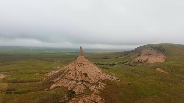 Chimney rock with fields, lakes and  sky in Chimney Rock National Historic Site, Nebraska, USA