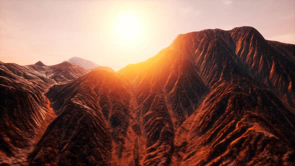 Sun Rays Over Mountains in a Valley alt