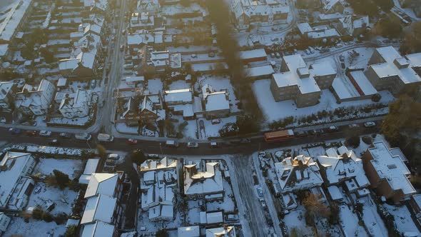 Snowy Streets and Houses in the Early Morning Aerial View