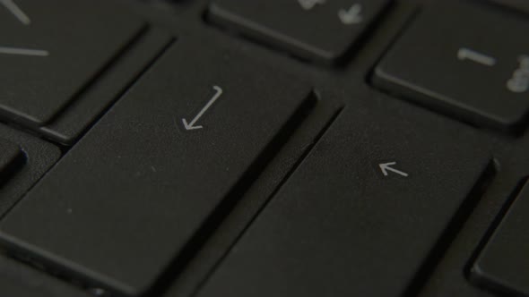 The Finger Presses the Enter Button on the Keyboard