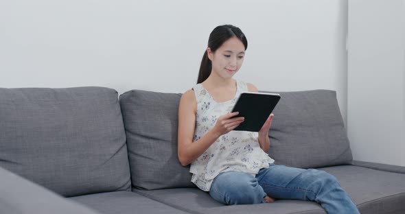 Woman use of tablet computer at home